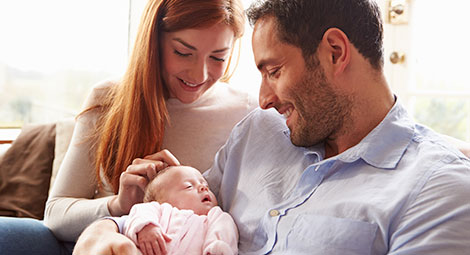 Mother and father with new baby